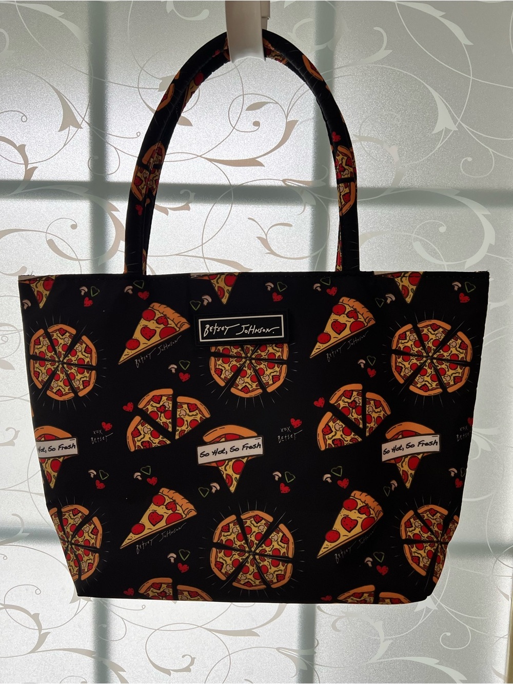 Betsey Johnson insulated lunch bag with pizza design and dual handles.